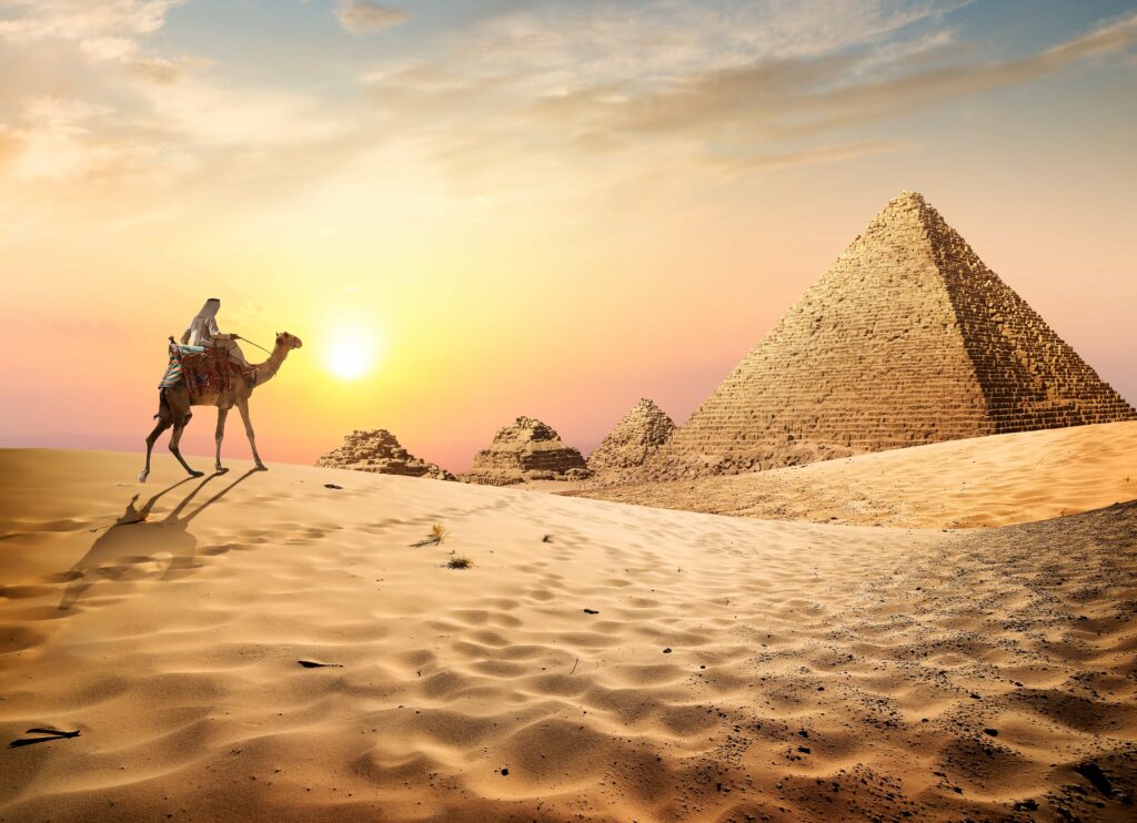 solo traveler camel ride at sunset Pyramids of Giza Egypt desert travel experience
